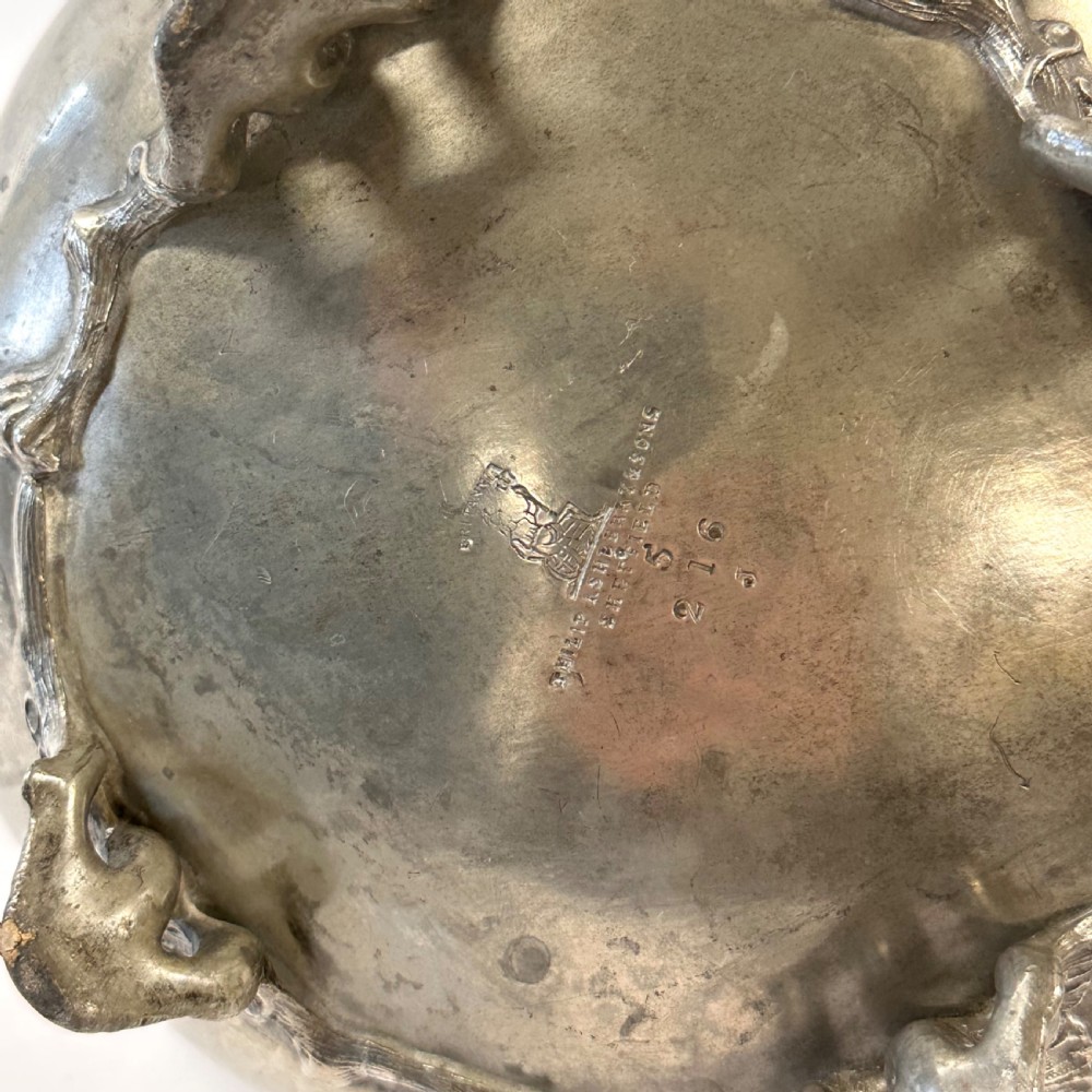 Victorian pewter teapot with a lobed body, curved spout, scrolled feet, and a bud-shaped lid finial. View VIII