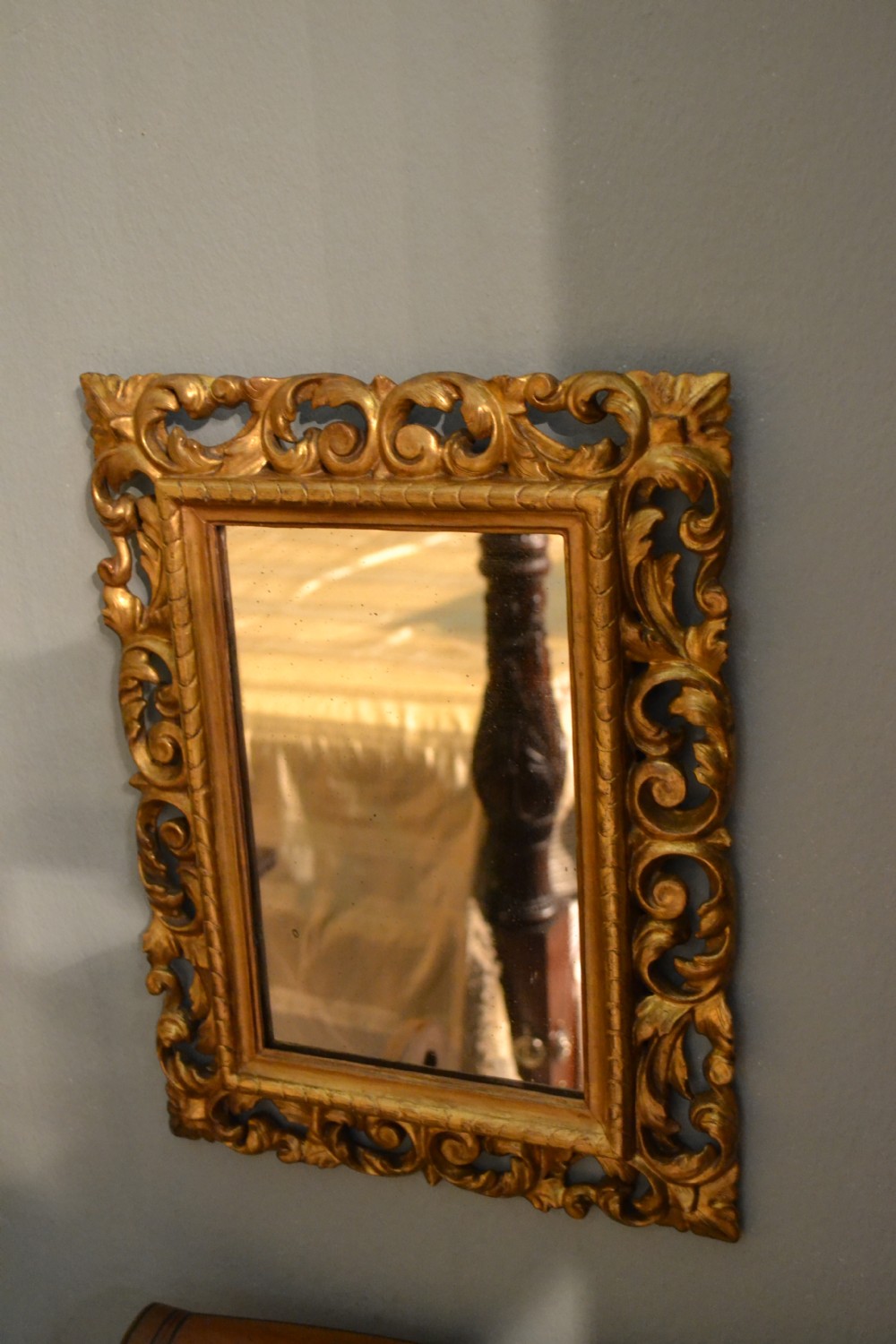 Lovely small hand carved and water gilded 19th century decorative mirror with original mercury plate in immaculate condition.