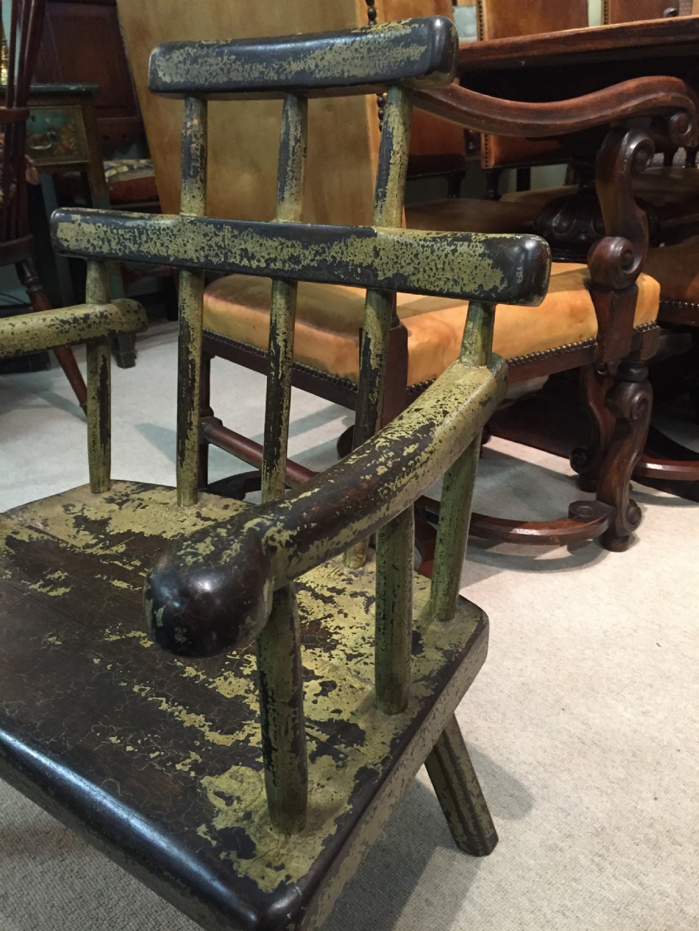 A delightful painted primitive childs chair in good condition
