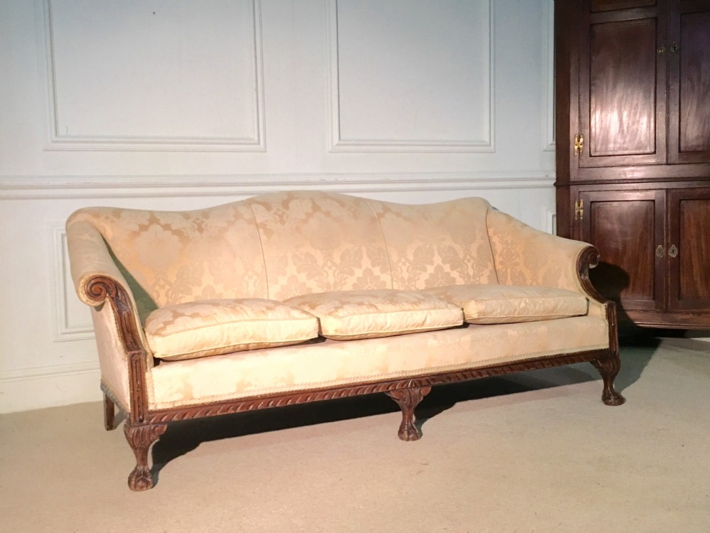 Elegant Chippendale style mahogany camel back sofa 