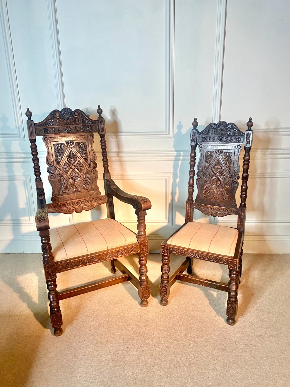 Set of 10 Jacobean style oak dining chairs