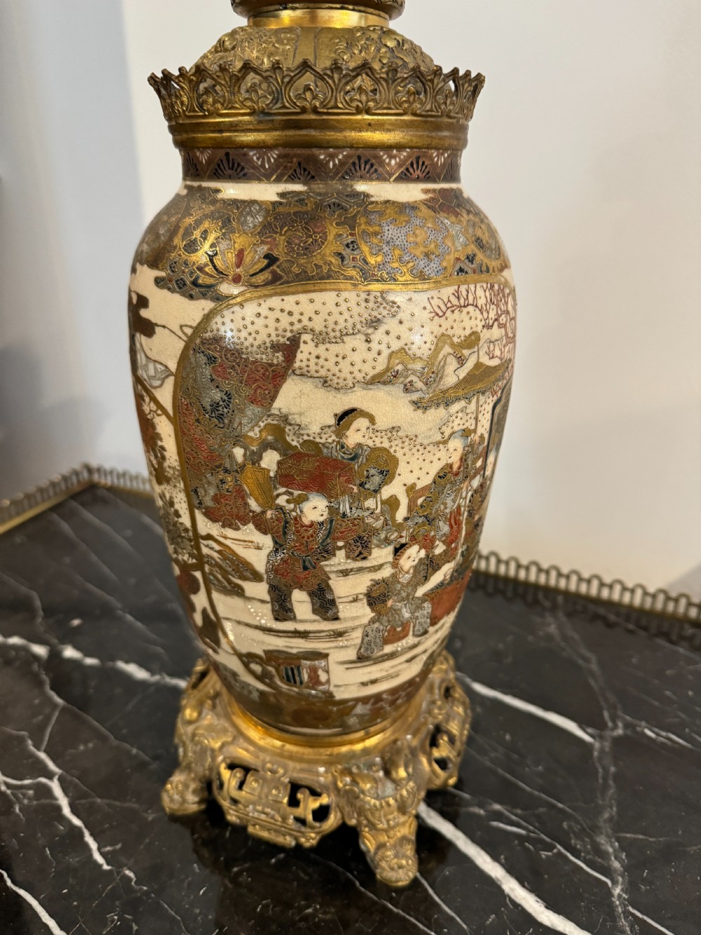 A late 19th-century Japanese Satsuma ceramic vase fitted as a table lamp, featuring detailed figurative enamel paintings and gilded ormolu bases and mounts. View II