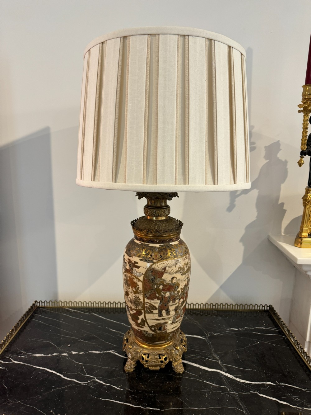 A late 19th-century Japanese Satsuma ceramic vase fitted as a table lamp, featuring detailed figurative enamel paintings and gilded ormolu bases and mounts. View IV