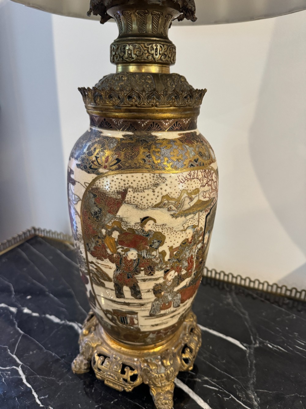 A late 19th-century Japanese Satsuma ceramic vase fitted as a table lamp, featuring detailed figurative enamel paintings and gilded ormolu bases and mounts. View V