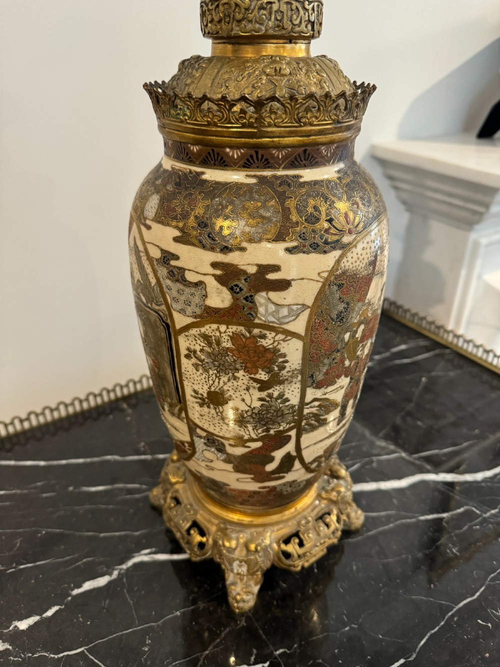 A late 19th-century Japanese Satsuma ceramic vase fitted as a table lamp, featuring detailed figurative enamel paintings and gilded ormolu bases and mounts. View VI