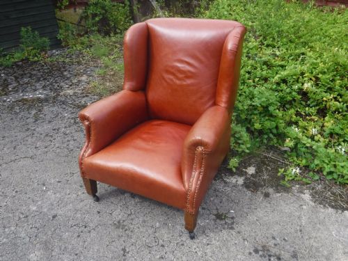 Early 20th Century Leather Shaped and Wing Back Armchair