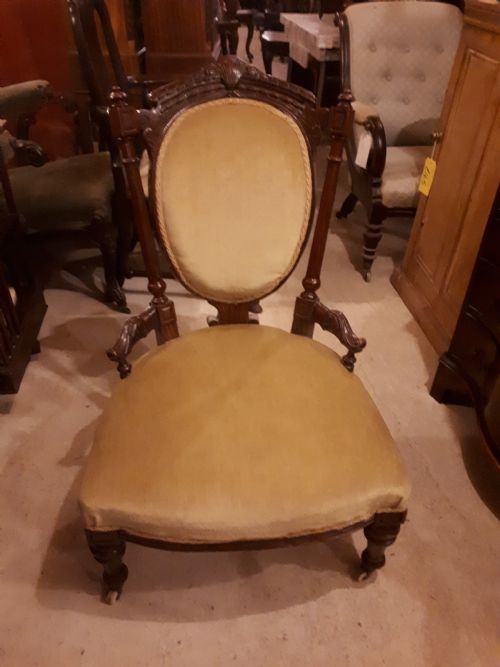 Late 19th Century Carved Walnut Nursing Chair.