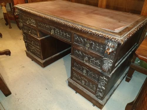 Late Victorian Carved Oak Kneehole Pedestal Desk.
