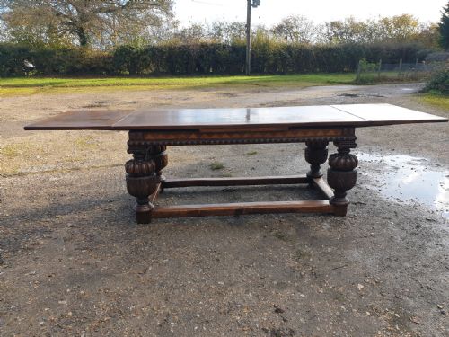 Large Carved Oak Draw Leaf Refectory Dining Table.