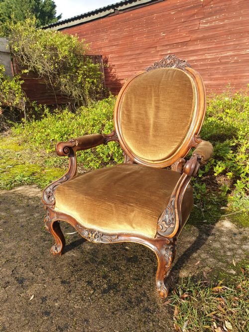 Mid Victorian Carved Walnut Framed Spoon Back Armchair.