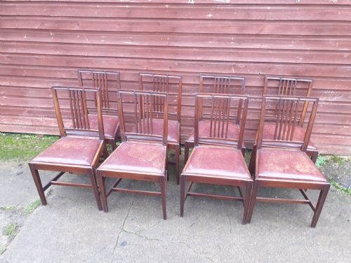 Set of 8 Mahogany Dining Chairs with Leather Seats.