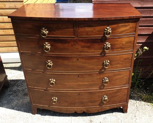 Regency Mahogany Bow Front Chest .