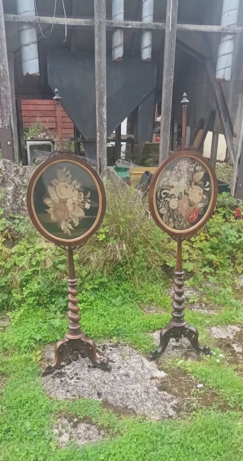 Pair of Early Victorian Rosewood Pole Screens with Needlework Panels.
