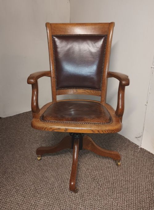 Good Revolving Oak and Leather Desk Armchair.