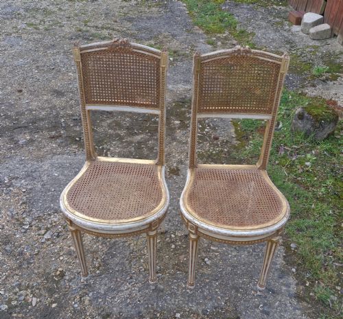 Pair of Elegant Gilded Decorated Caned Bedroom Chairs from the Series "The Crown".