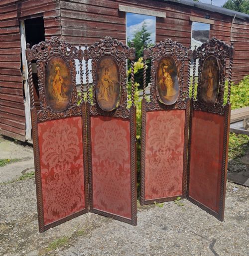 Pair of Carved Oak Folding Dressing Screens.