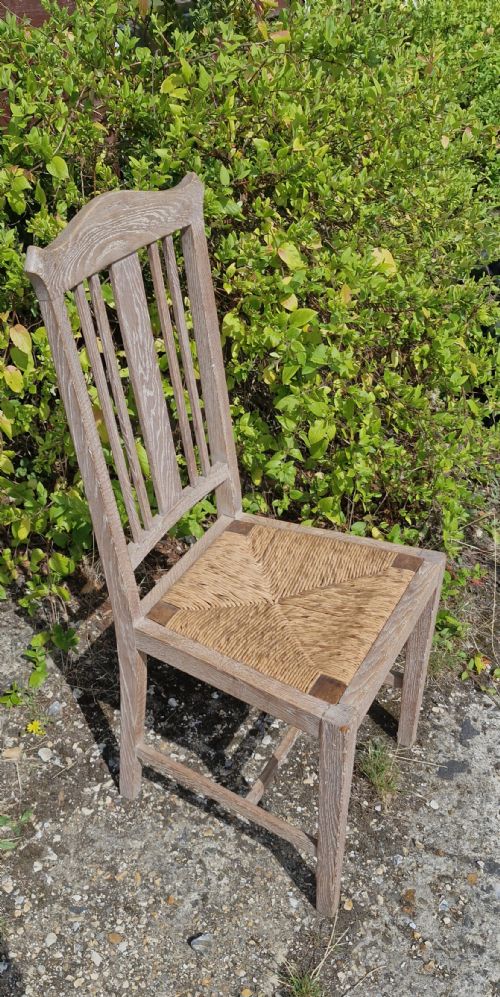 Single Limed Oak Rush Seat Chairs in the Manner of Heals.