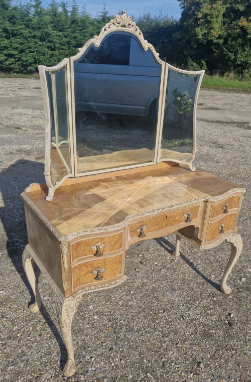 Walnut and Carved Kneehole Dressing Table.