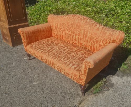Late Victorian Upholstered Sofa on Mahogany Turned Legs.