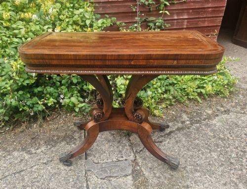 Regency Rosewood Swivel Top Games Table in the Manner of William Trotter.