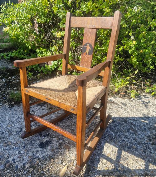Oak Inlaid Childs Rocking Chair in the Manner of Liberty's.