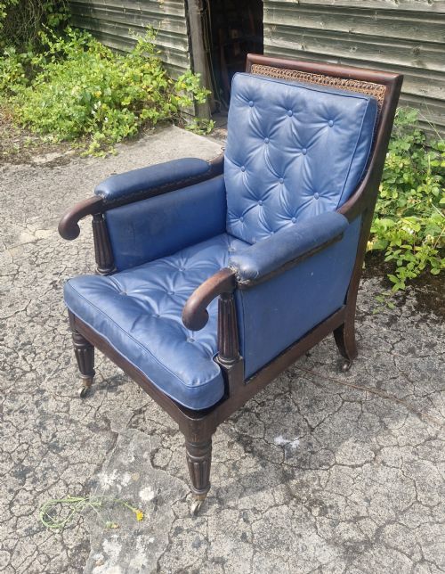 19TH CENTURY MAHOGANY BERGERE LIBRARY ARMCHAIR