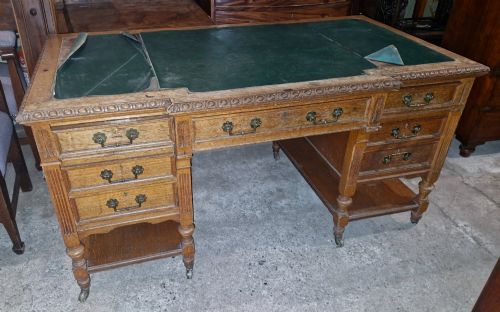 Edwardian Carved Oak Kneehole Pedestal Desk.