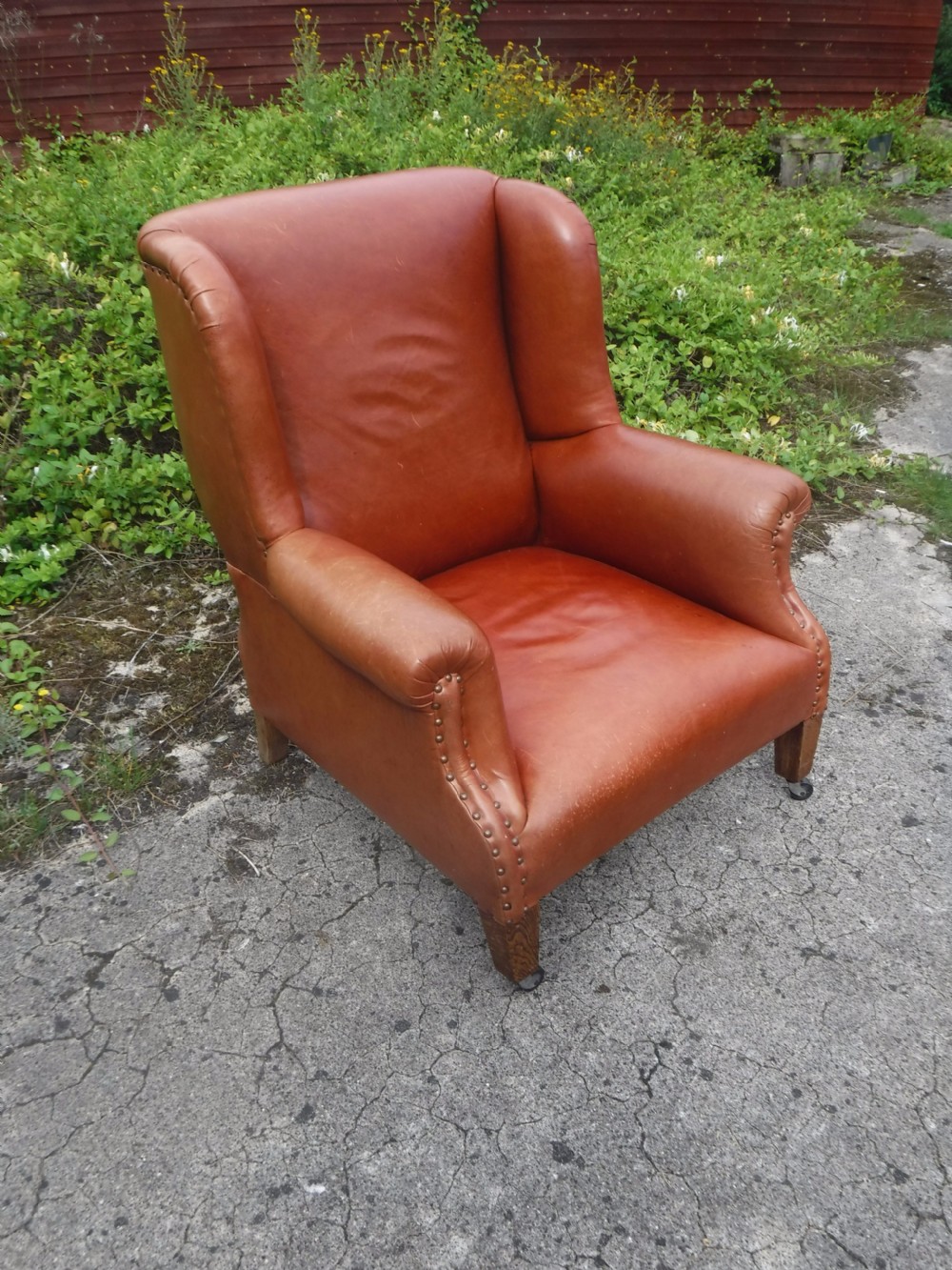 Early 20th century leather shaped and wing back armchair View III