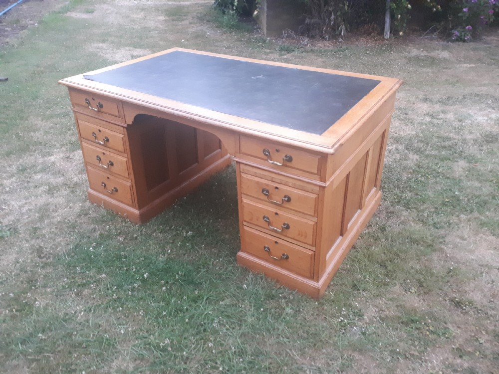 Large early 20th century panelled oak desk
