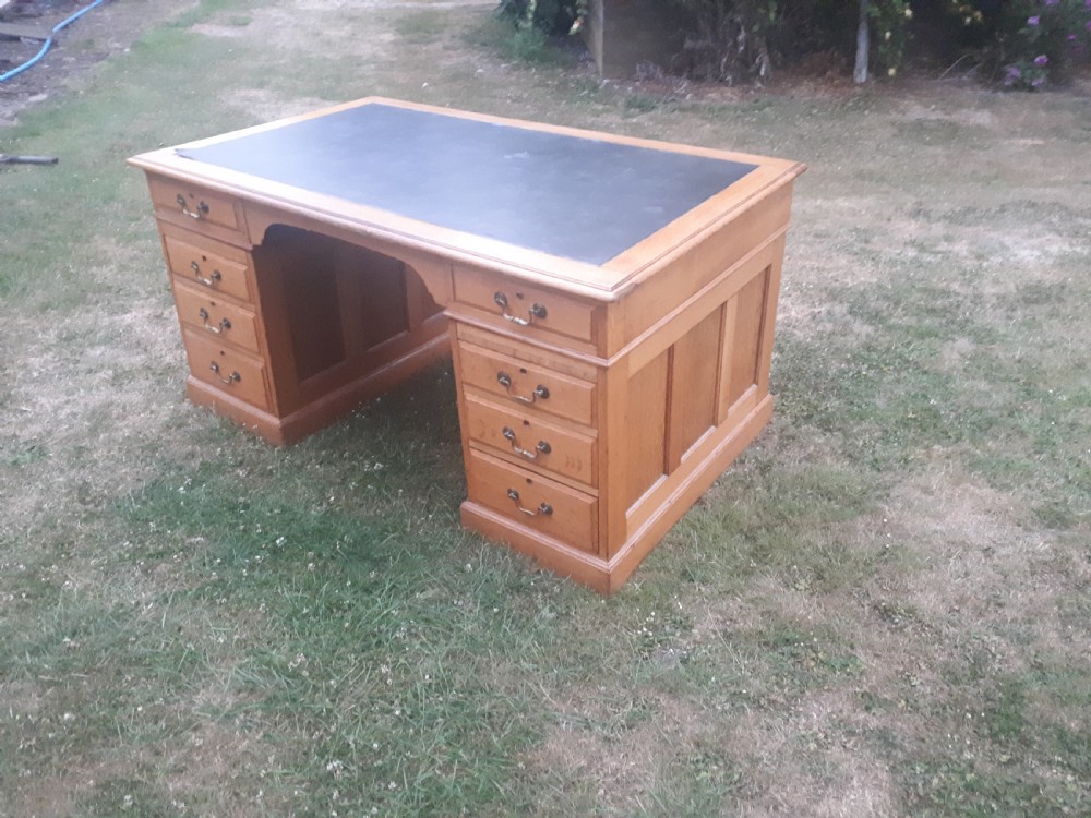 Large early 20th century panelled oak desk View II
