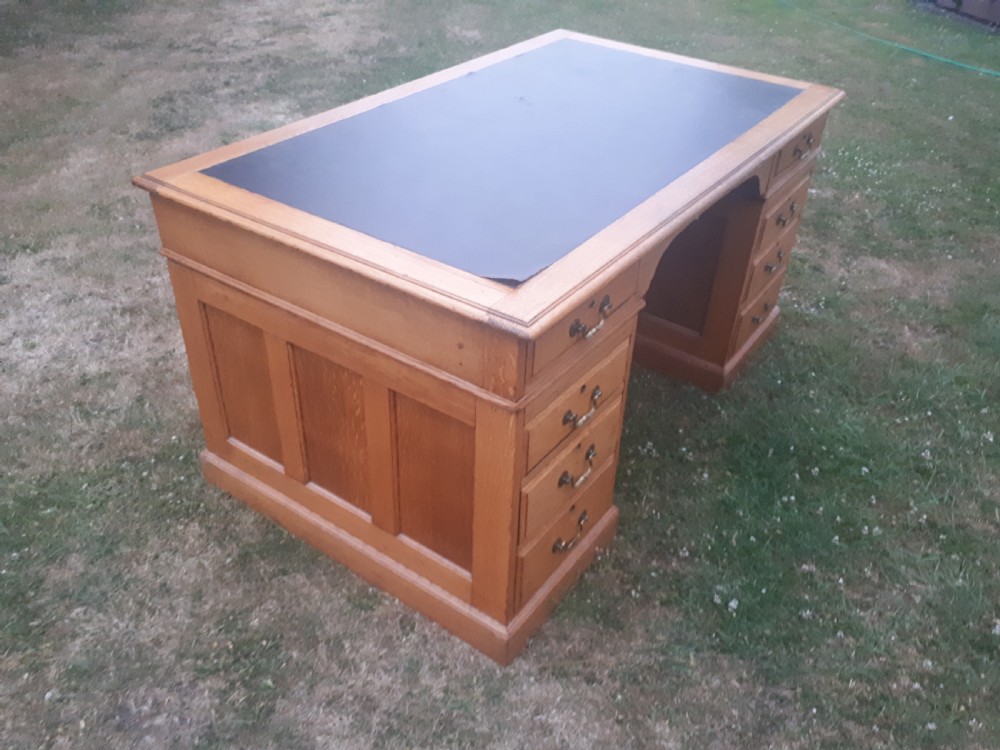 Large early 20th century panelled oak desk View IV