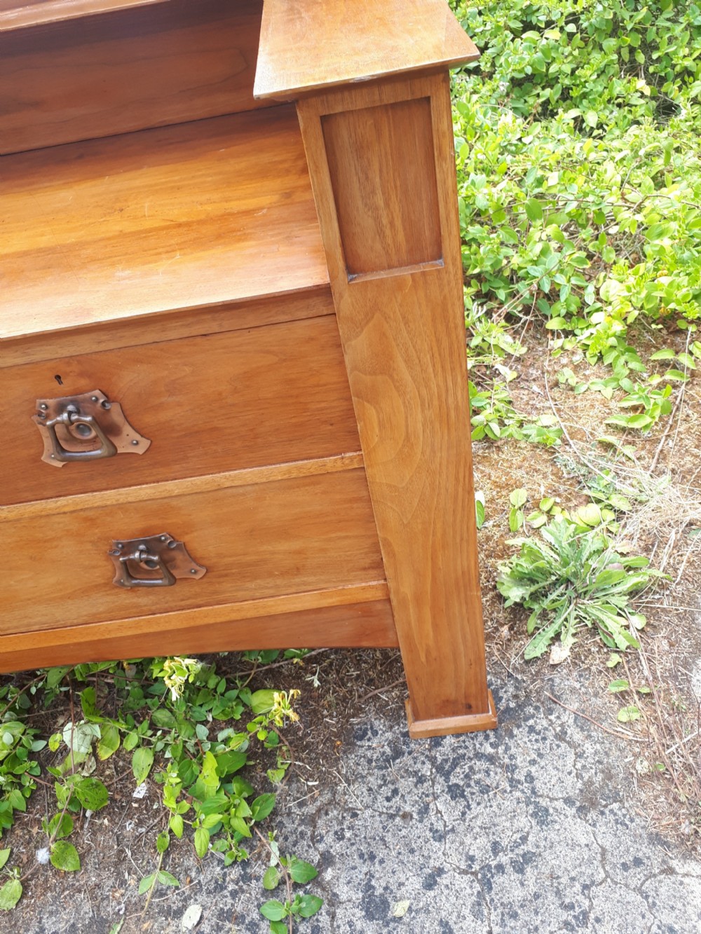 A late nineteenth-century Arts and Crafts wooden dressing chest featuring an integrated mirror, upper mantle shelf, two short drawers, one long drawer, and copper backplate handles. View VII