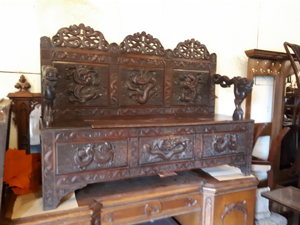 Oriental carved hall seat.