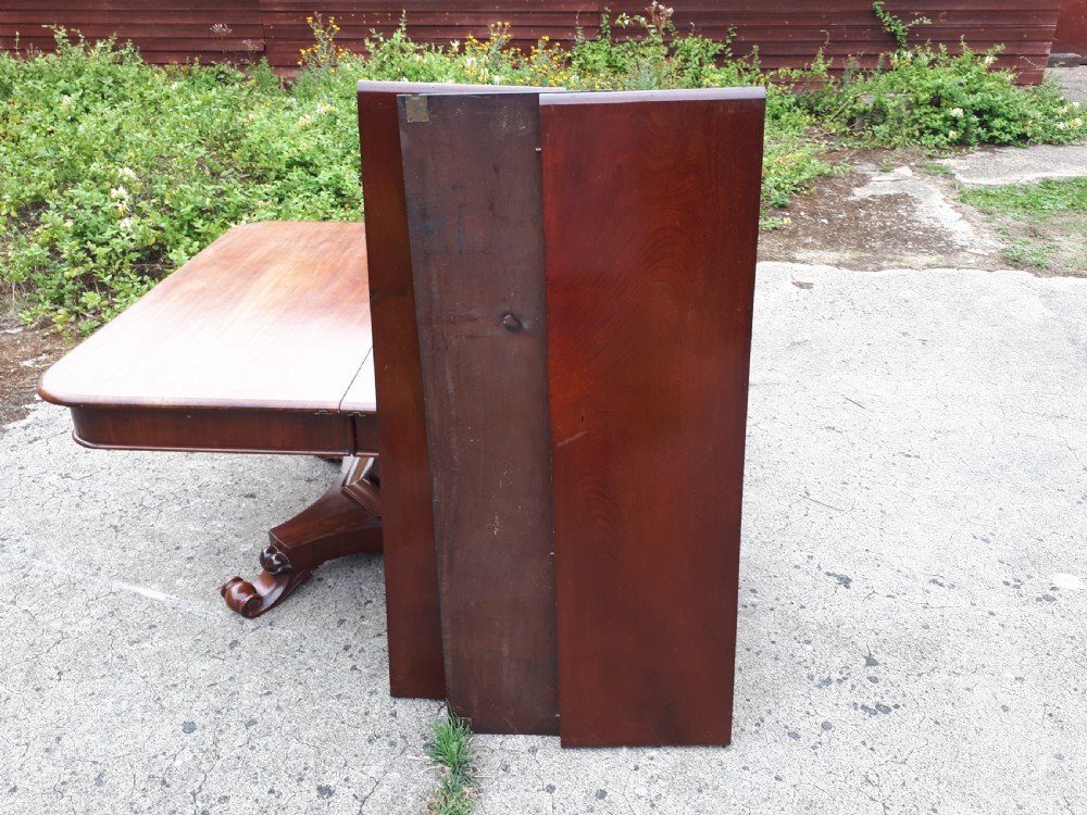 Unusual Regency mahogany central pillar extending dining table. View III