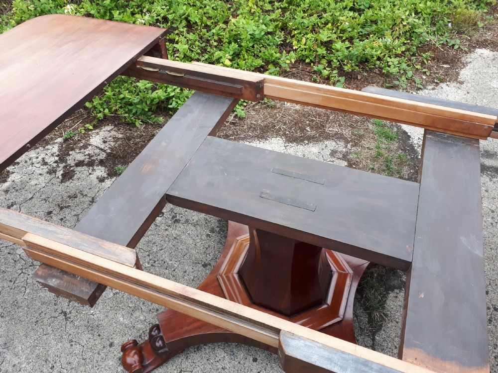 Unusual Regency mahogany central pillar extending dining table. View IV