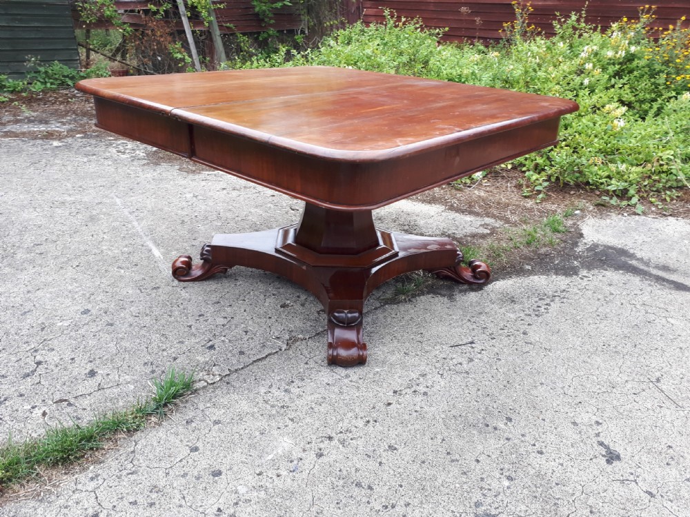 Unusual Regency mahogany central pillar extending dining table. View V