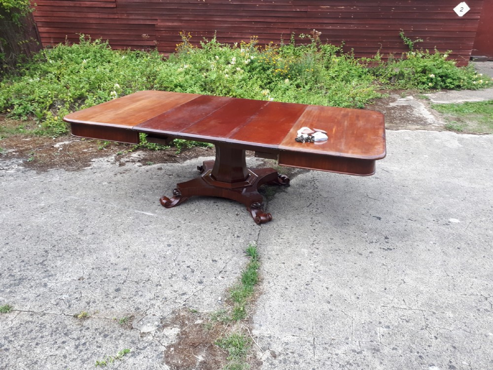 Unusual Regency mahogany central pillar extending dining table. View VI