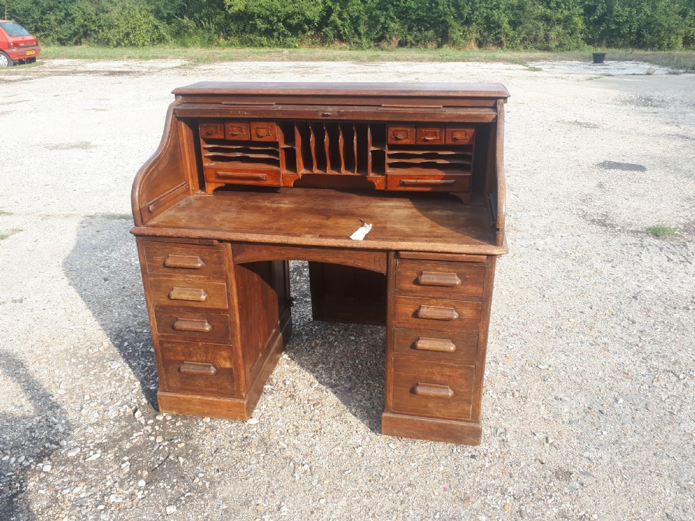 Early 20th century oak roll top pedestal desk