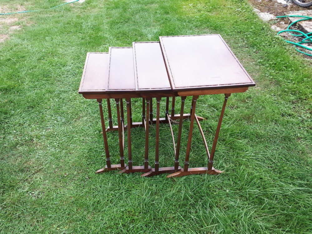 Nest of 4 Edwardian mahogany occasional tables