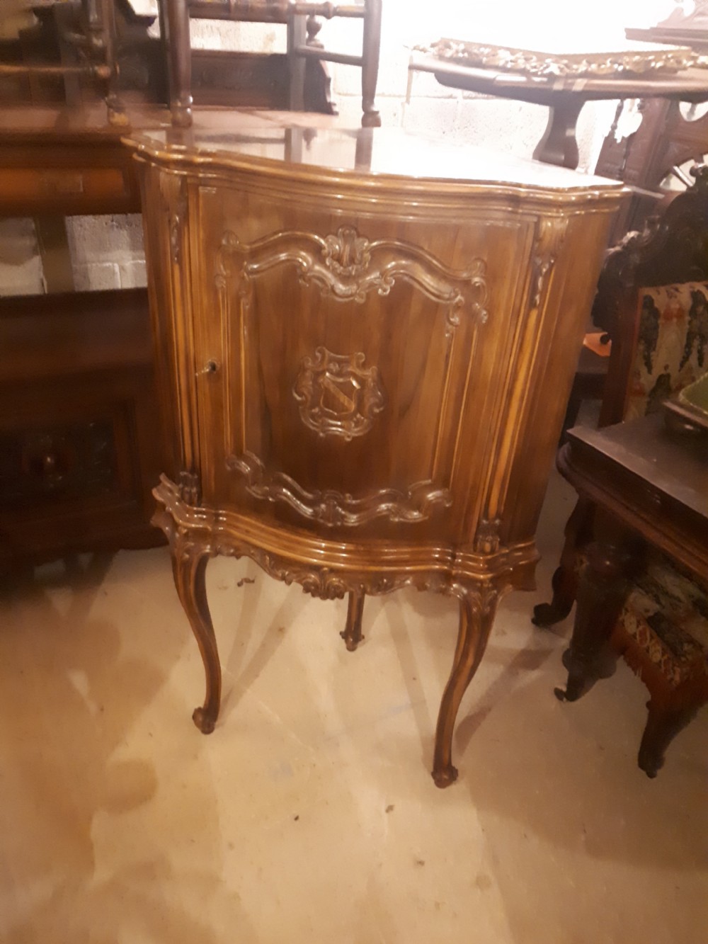 Early 20th century walnut revolving door drinks cabinet