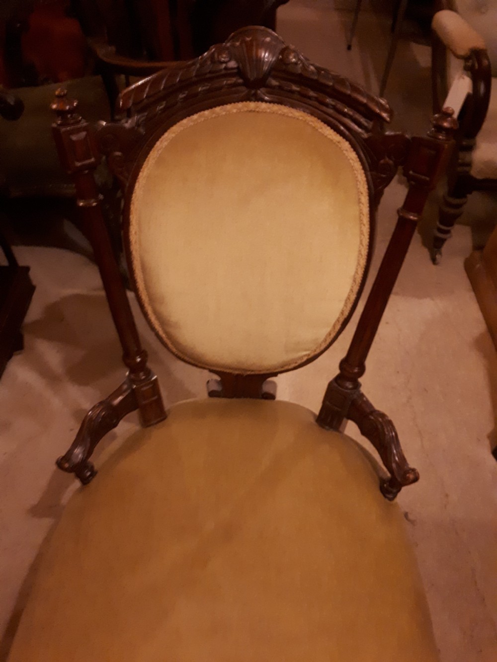 Late 19th century carved walnut nursing chair. View II