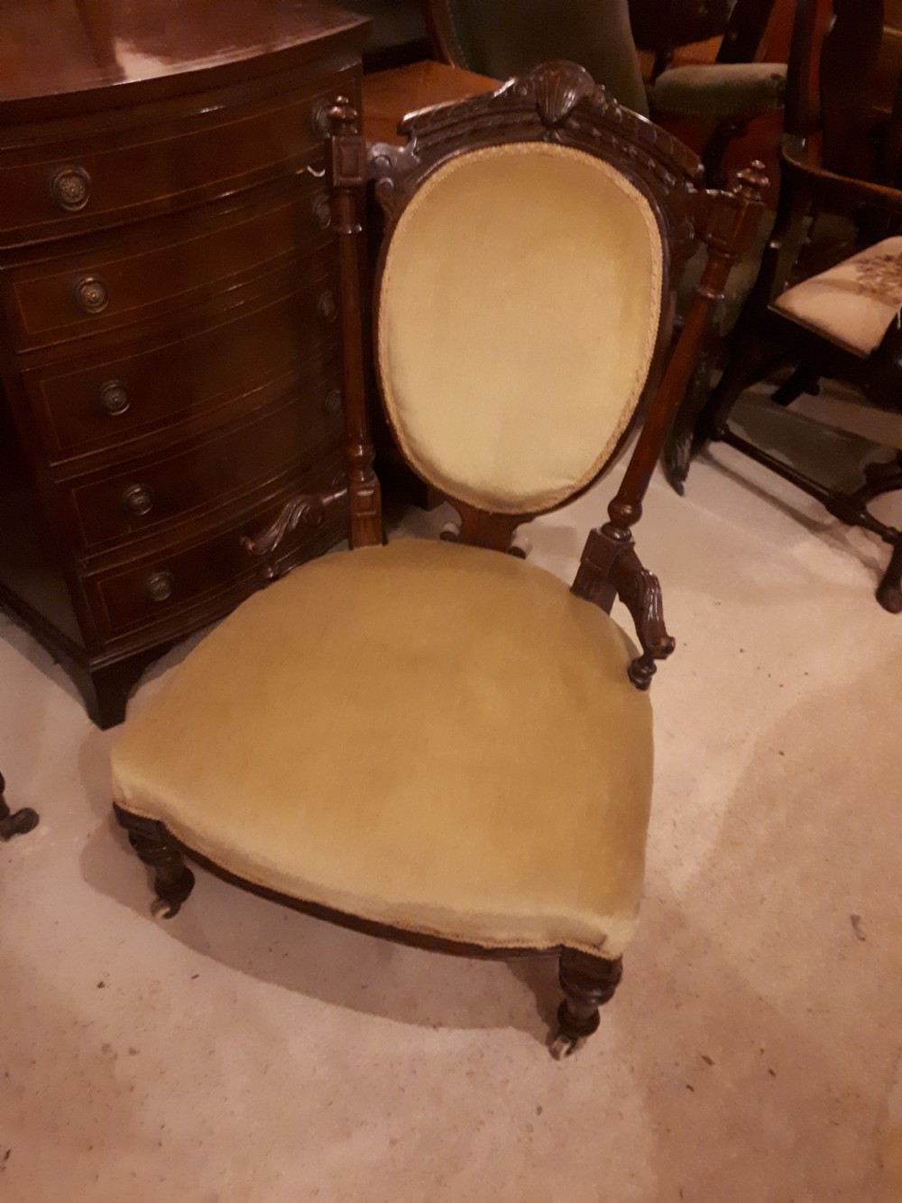 Late 19th century carved walnut nursing chair. View III