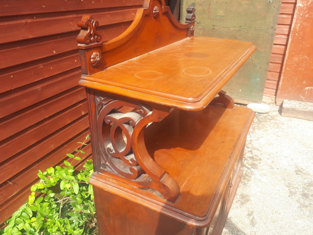 A 19th-century Victorian mahogany side cabinet featuring a two-door base cupboard, open display tier with scroll supports, and a carved gallery back. View III