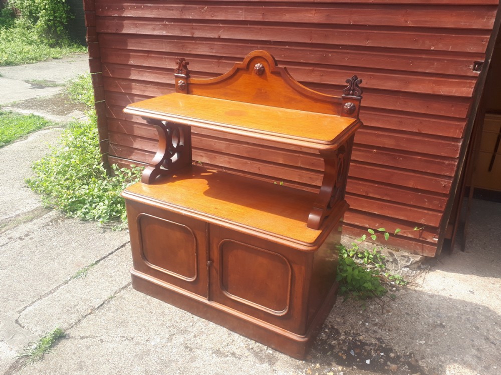 A 19th-century Victorian mahogany side cabinet featuring a two-door base cupboard, open display tier with scroll supports, and a carved gallery back. View VII