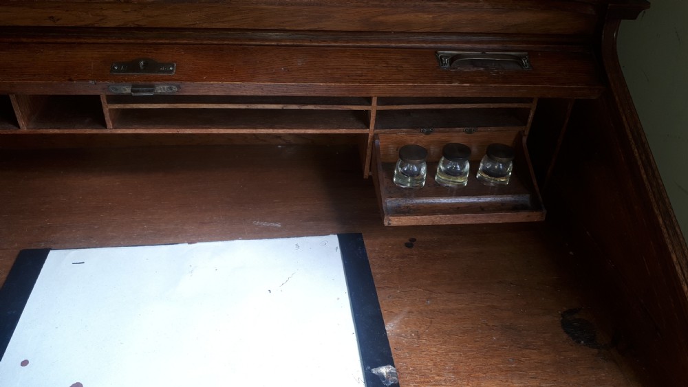 Neat Early 20th century tambour top desk View IV