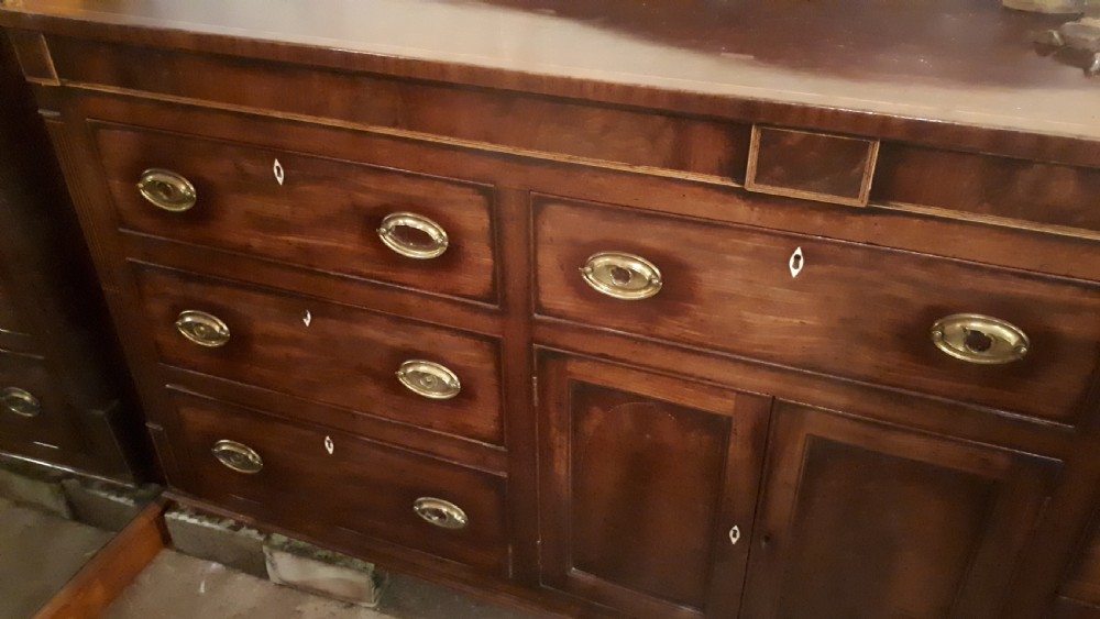 Large early 19th century inlaid mahogany dresser base  View II