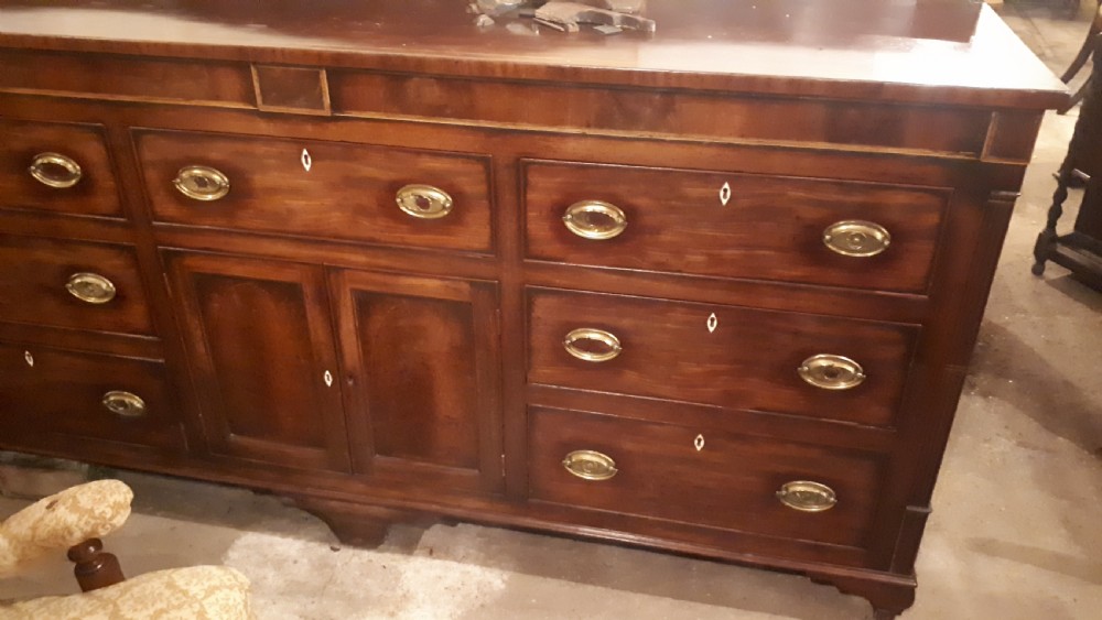 Large early 19th century inlaid mahogany dresser base  View III
