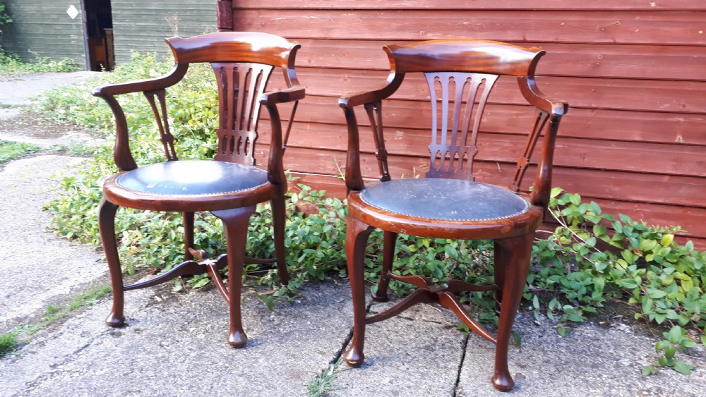 Pair of early 20th century mahogany desk armchairs