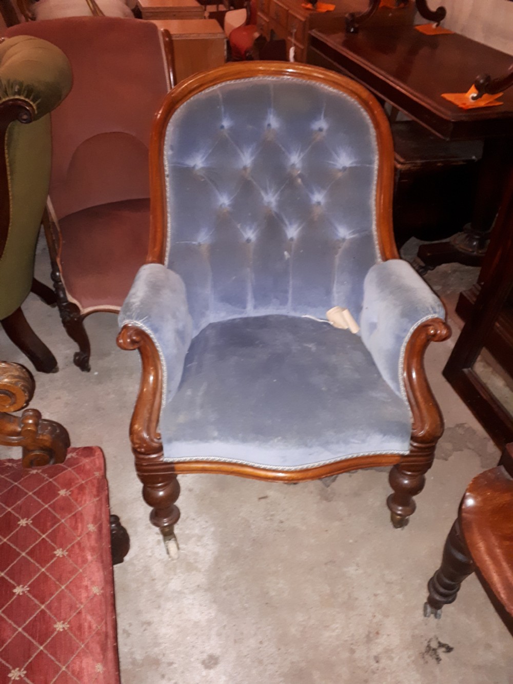 Mid Victorian upholstered button back armchair