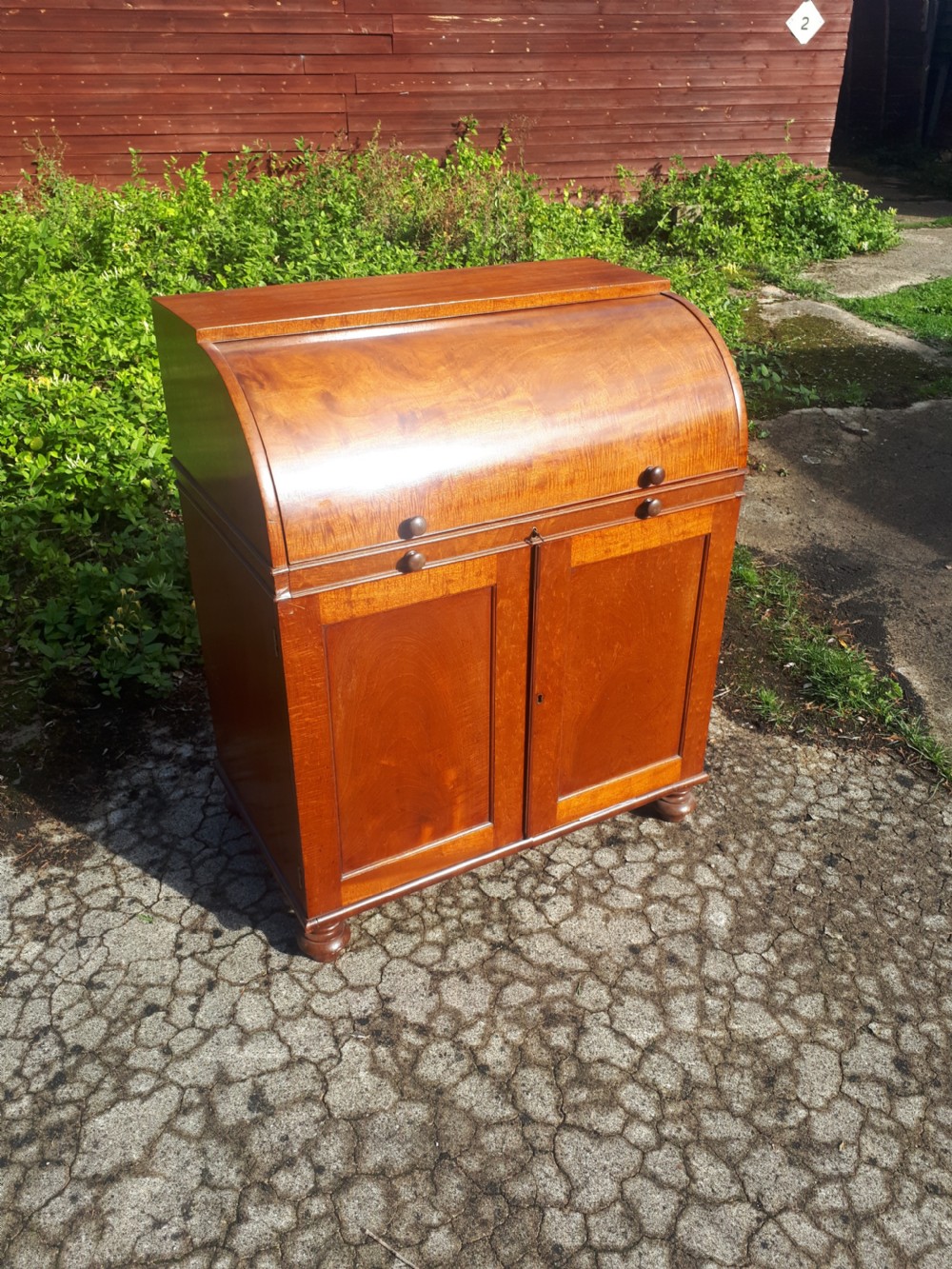 Small and neat Regency cylinder top writing desk